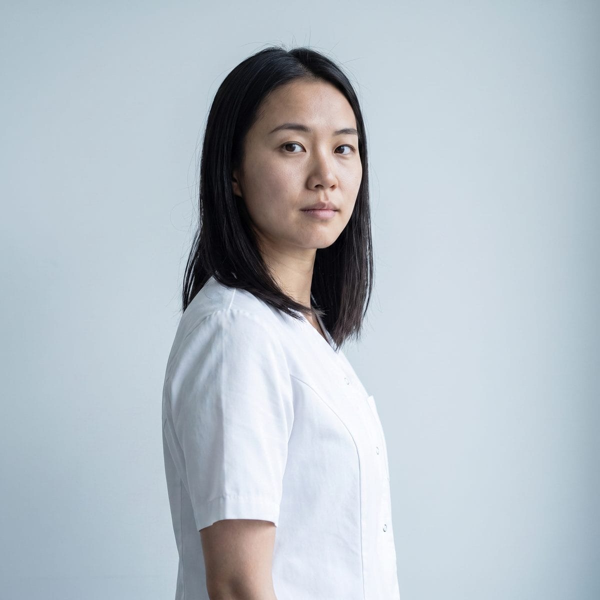 Portrait of one of the practice's injectors against a plain pale background.